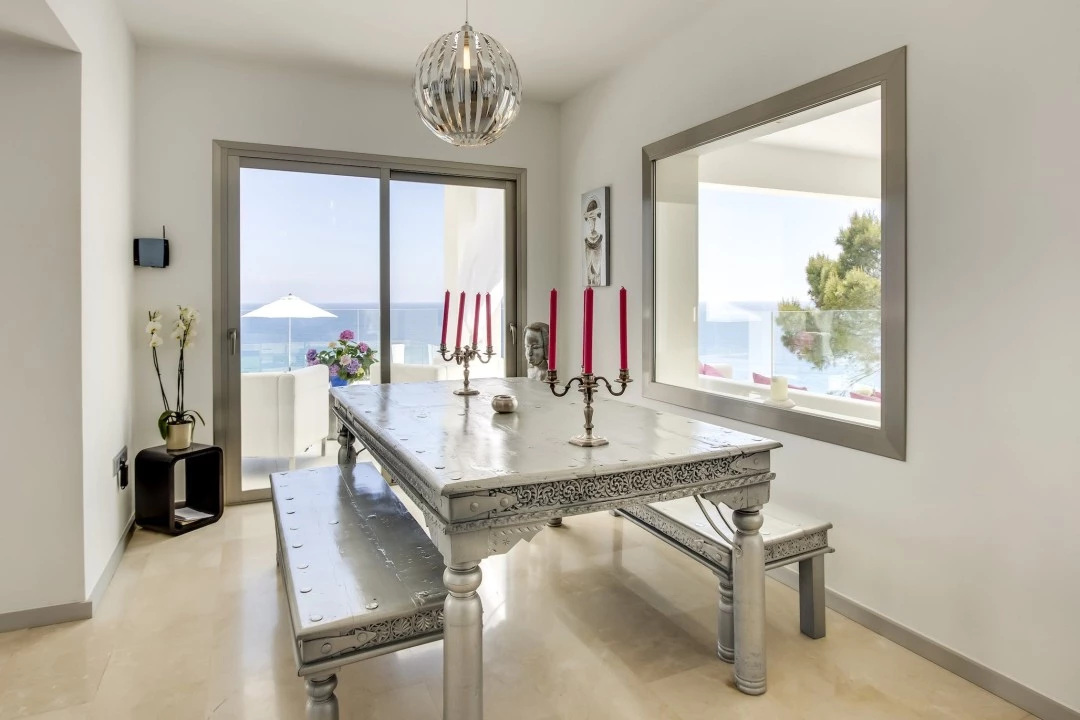 1681216749-Luxury real estates Ibiza to rent villa Raya Dining room table 1.webp